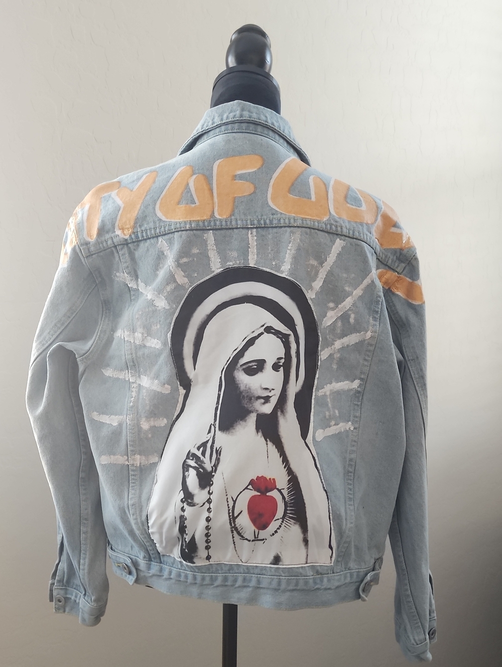 Light Blue Painted Denim Unisex Jacket with religious graphic sewn-in.